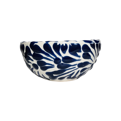 side view of a blue and white Puebla design ceramic bowl