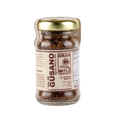 50g clear jar of grounded agave worm with a beige branded label and gold lid.