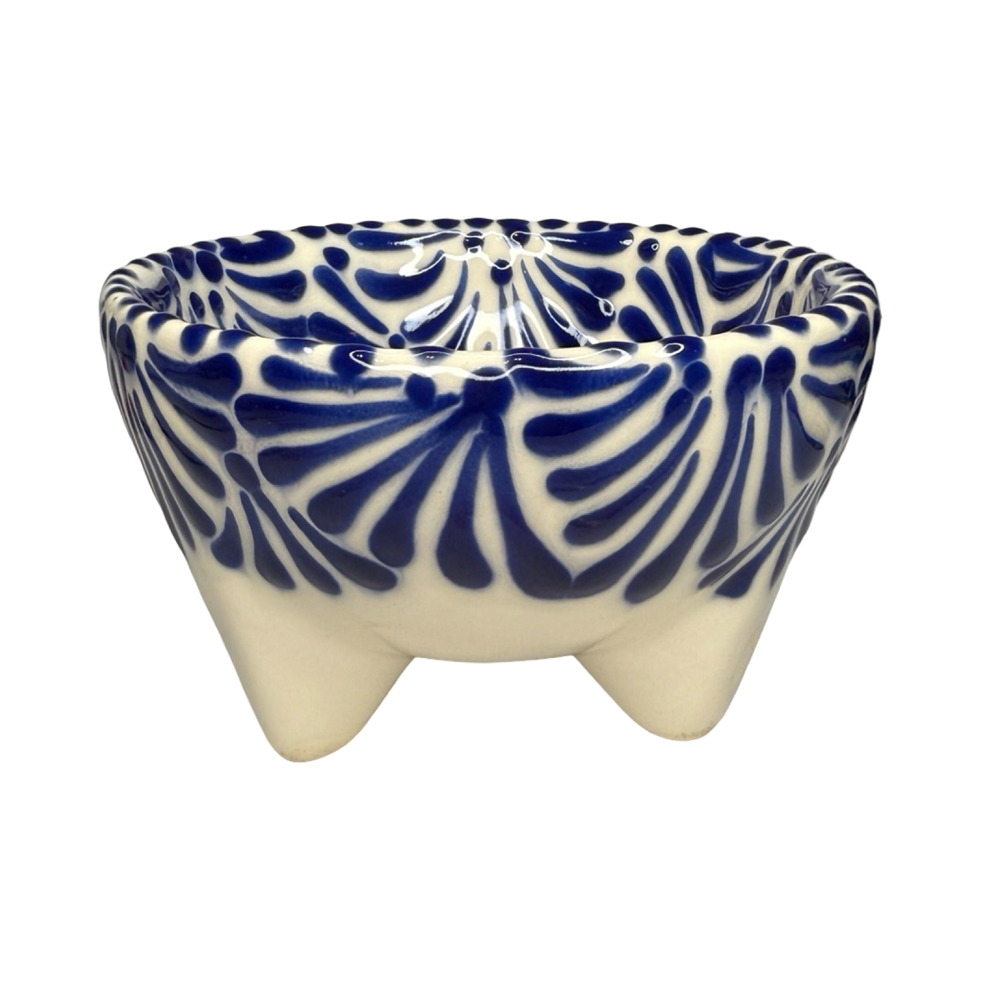 Handcrafted ceramic molcajete-style bowl with a blue floral design on a cream background and three short legs.