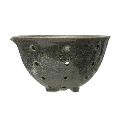 Green/blue stoneware berry bowls with drainage holes and a smooth glazed finish.