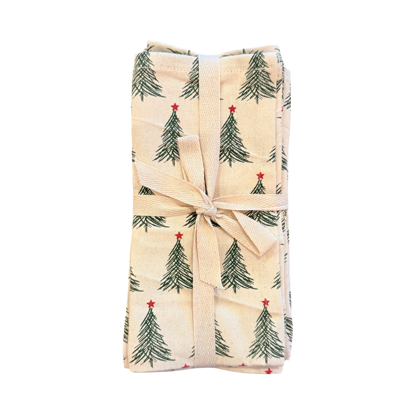 Set of four stonewashed cotton napkins printed with green Christmas trees topped with red stars, tied together with a beige ribbon.