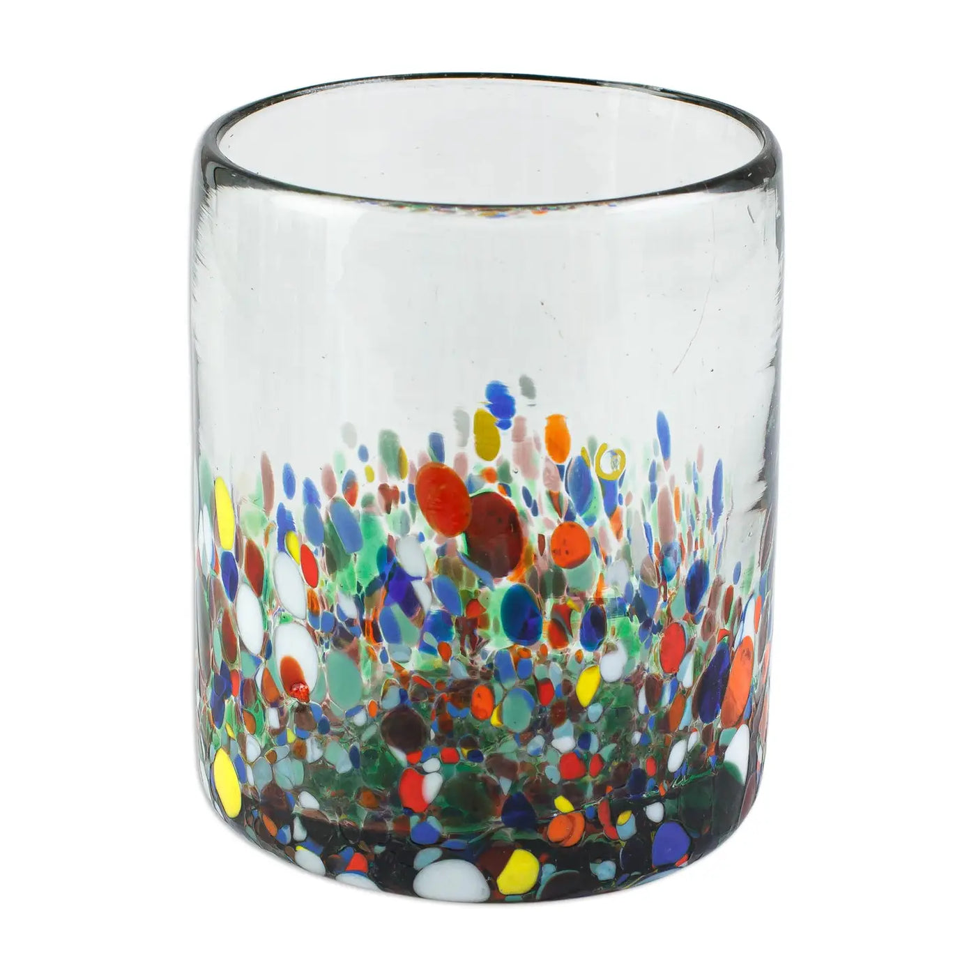Clear handblown glass juice glass decorated with multicolored floral-like confetti patterns in red, yellow, blue, green, and white near the base.