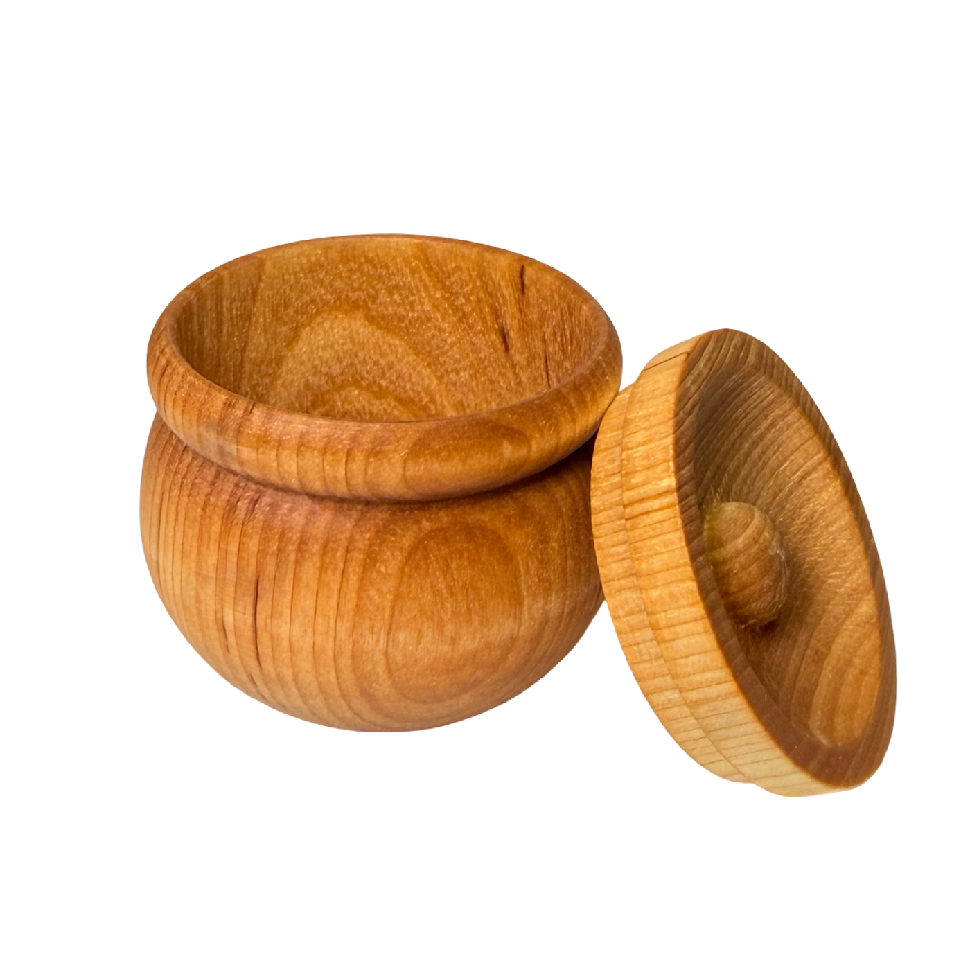 Small round wooden pinch pot with a fitted lid, shown open.
