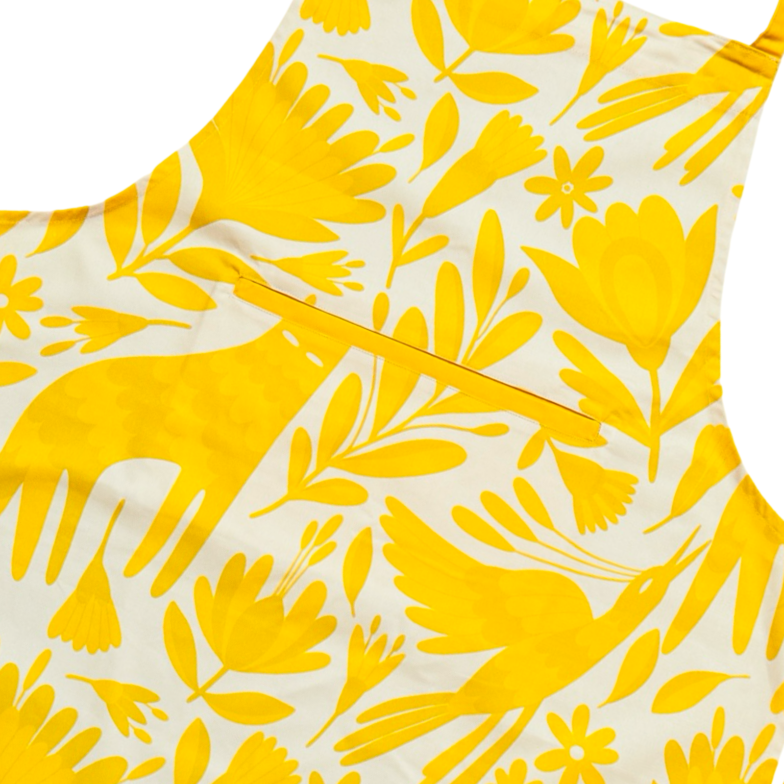 Close up view of apron featuring a yellow Mexican otomi design with front pocket, yellow neck and waist ties.