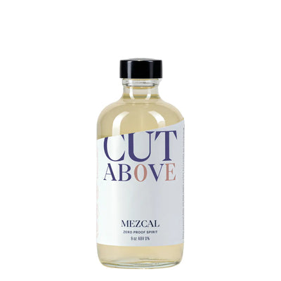 Clear 6-oz bottle labeled “Cut Above Mezcal, Zero Proof Spirit,” pale straw liquid with black cap.