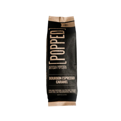 A sleek black and beige bag of "Popped Artisan Popcorn," labeled "Bourbon Espresso Caramel." The design features bold, modern typography with details such as "Non-GMO Popcorn," "Gluten-Free," "Vegan," "Dairy-Free," "No Preservatives," and "Nut-Free." The weight is stated as 6.5 oz (184 g).