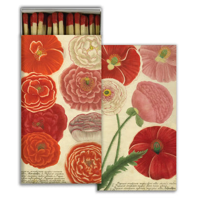 A beautifully designed matchbox featuring a vintage botanical illustration of vibrant red, pink, and white flowers with detailed petals. The box is open, revealing matches with red-tipped heads neatly arranged inside.