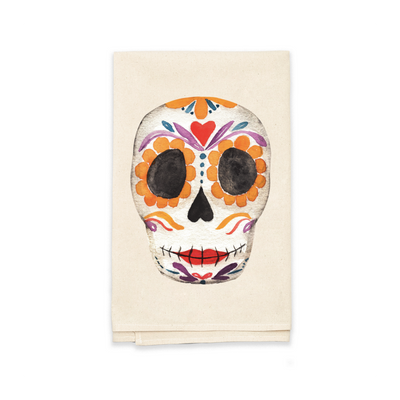 natural towel folded in half featuring a watercolor image of a sugar skull