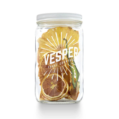 Clear 32 oz jar with dried fruits and peppers with white branded letters