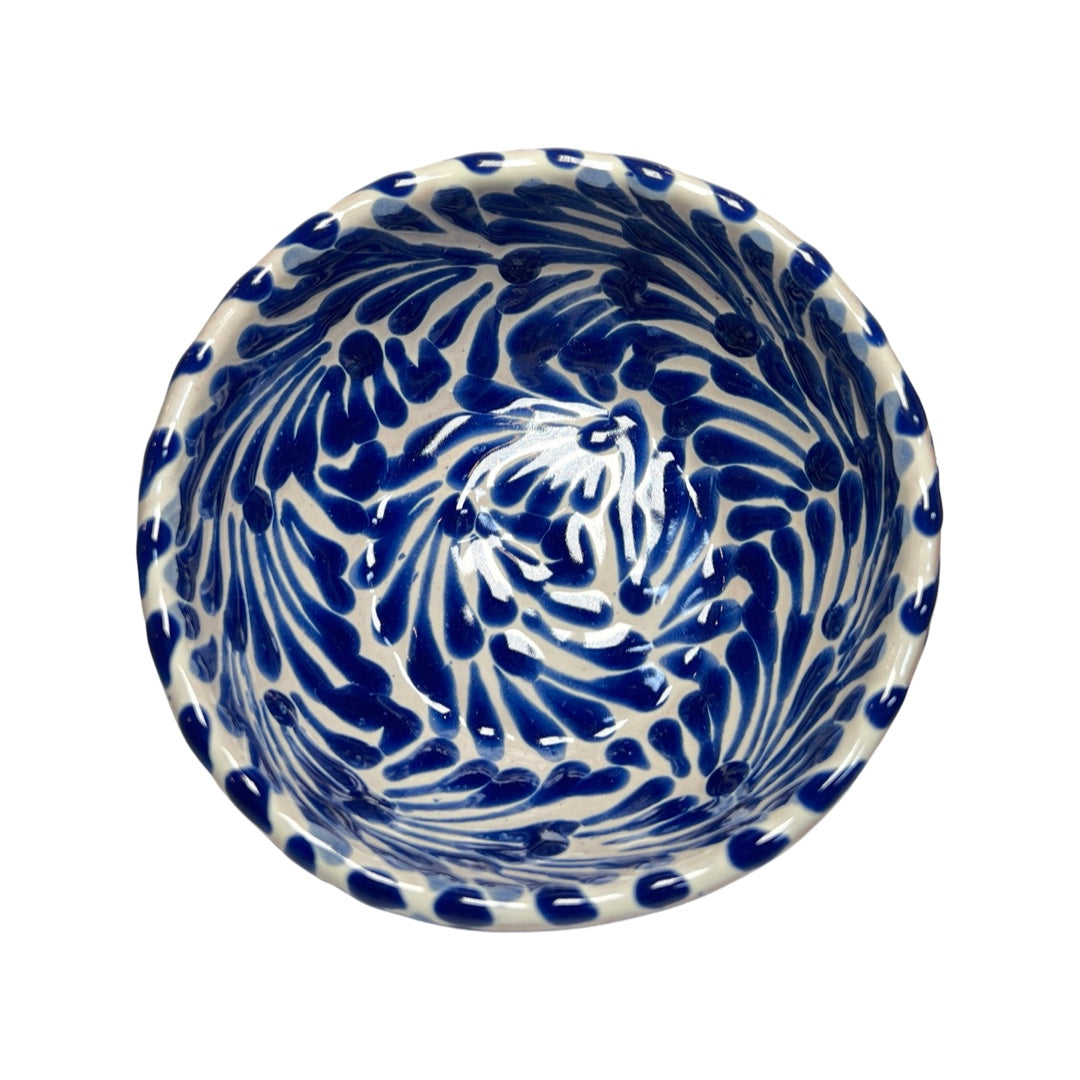 Top view of a ceramic bowl with a white and blue Puebla design