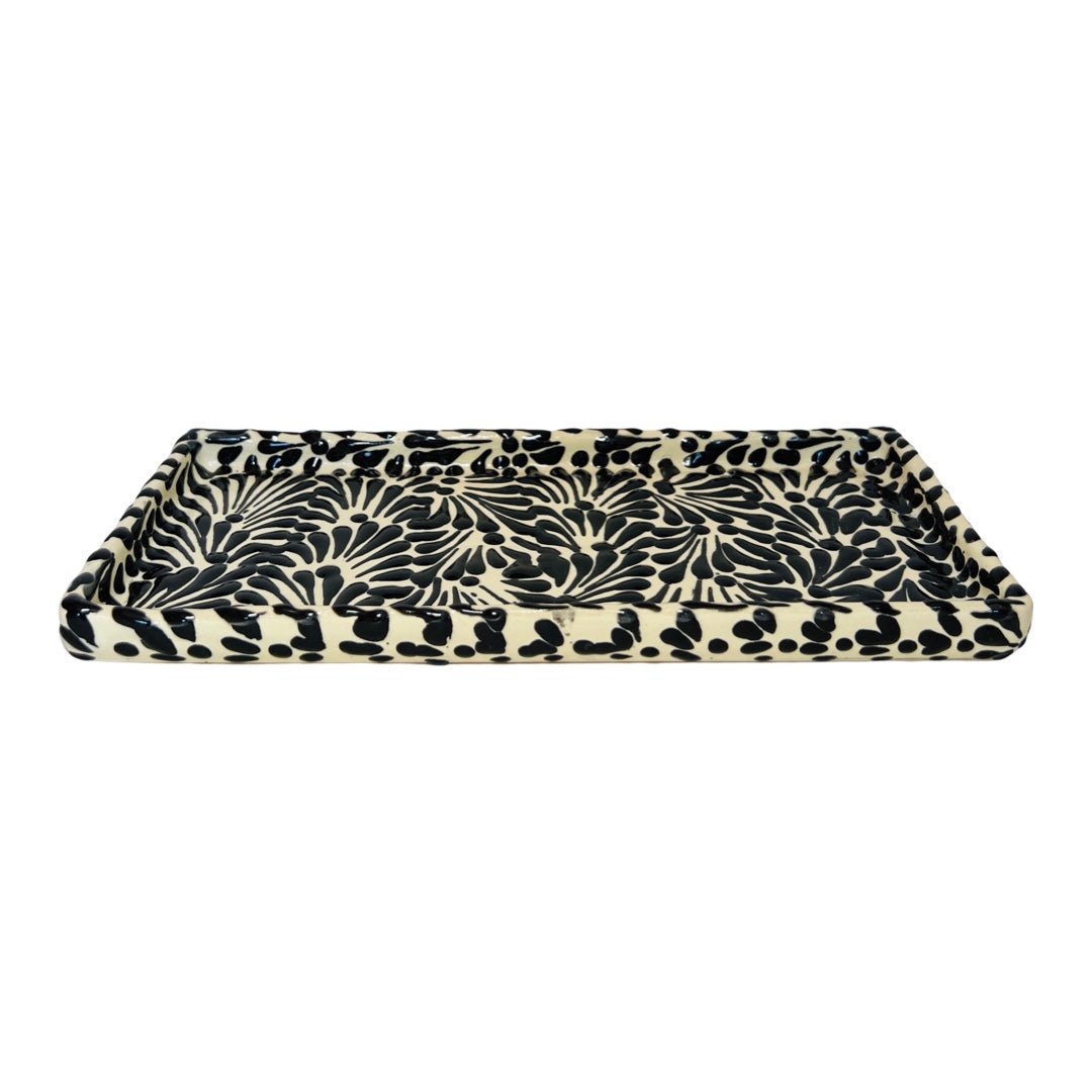 side view of a black and white Puebla design rectangular ceramic tray