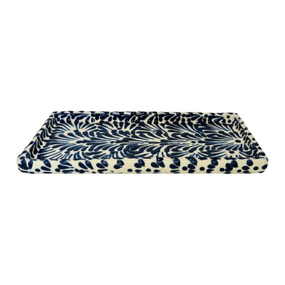 side view of a blue and white Puebla design rectangular ceramic tray