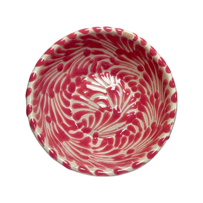 Top view of a ceramic bowl with a white and pink Puebla design
