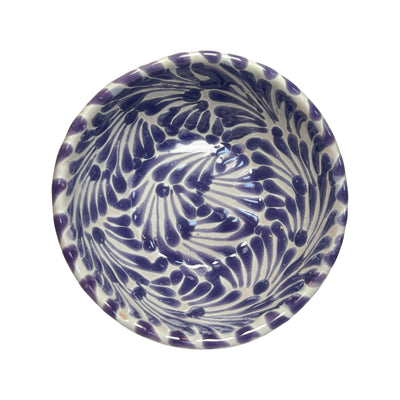 Top view of a ceramic bowl with a white and purple Puebla design
