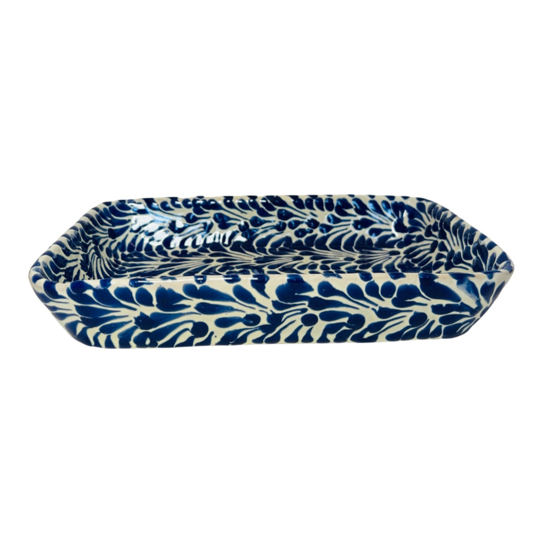 side view of a blue and white Puebla design rectangular ceramic dish