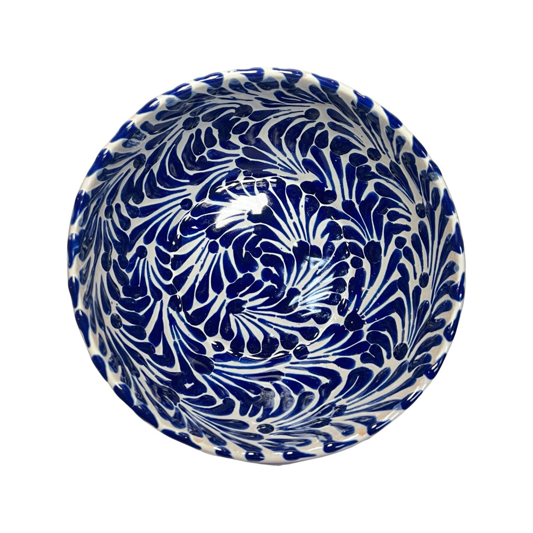 Top view of a ceramic bowl with a blue and white Puebla design