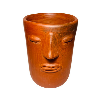 Barro rojo pot with a face