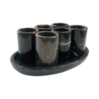 set of 6 black marble shot glasses sitting on an oval black marble tray