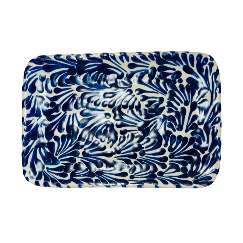 top view of a blue and white Puebla design rectangular ceramic plate