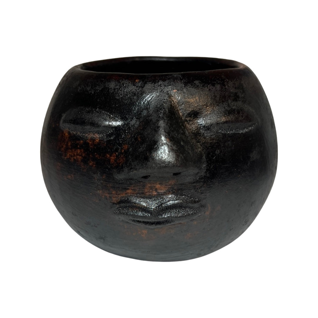 Front view of dark brown colored clay pot 
