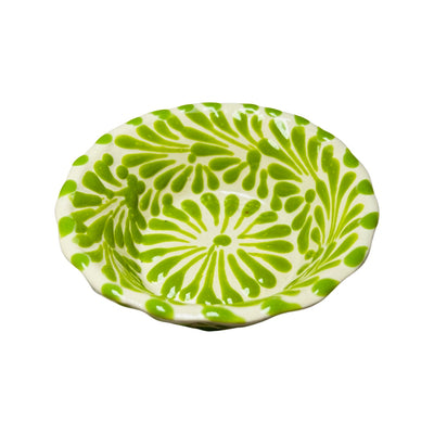 top view of a green and white Puebla design ceramic bowl with a scalloped edge