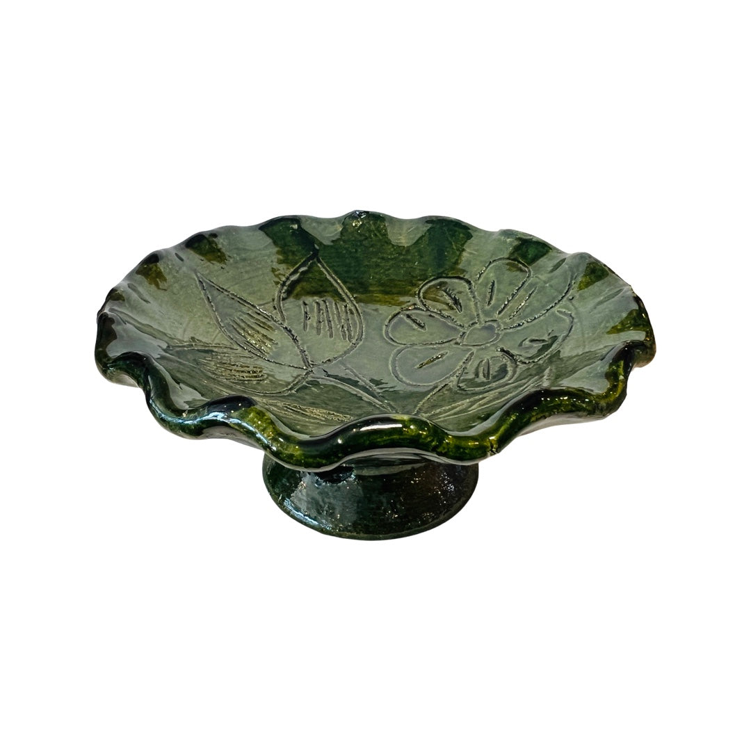 Top view of a Barro Verde pedestal jewerly holder featuring a wave edge and etched flower design on the top.