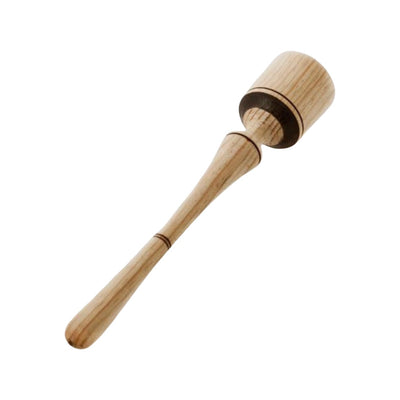 Wooden machacador, or masher, with accents of burnt wood for design. 