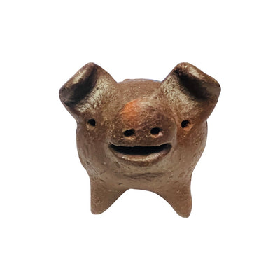 Front view of a red clay pig