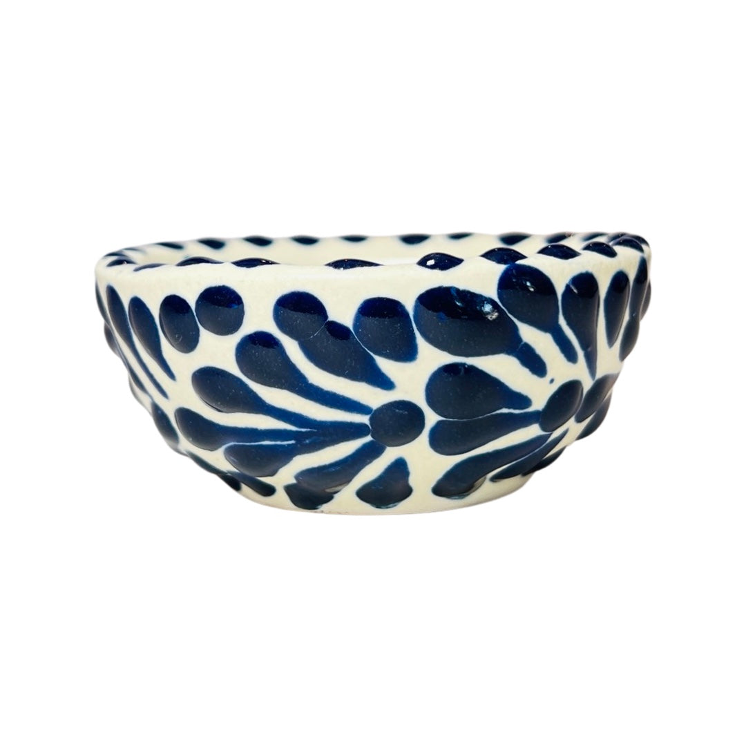 Side view of a blue and white Puebla design ceramic bowl