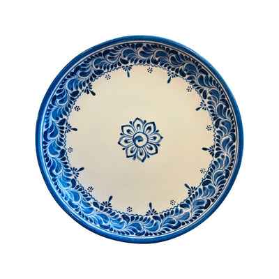 blue and cream ceramic dinner plate with a blue design