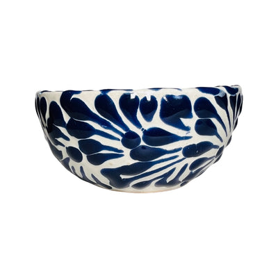side view of a blue and white Puebla design ceramic bowl