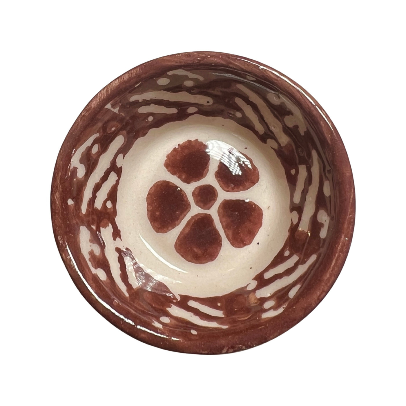 brown ceramic bowl with a flower design