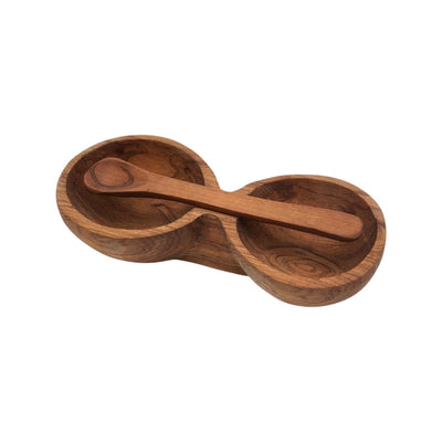 Wooden double bowl with a spoon resting on the top of it.