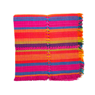brightly colored handwoven napkin folded in quarters. Colors consist of orange, purple, pink, blue and yellow
