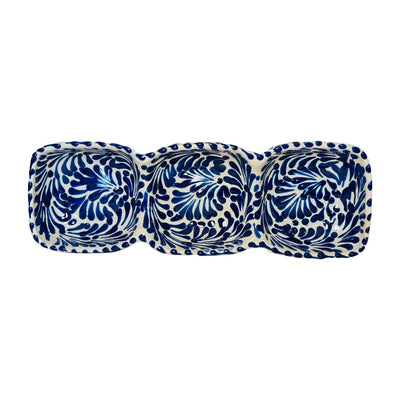 top view of a blue and white Puebla design rectangular ceramic trio appetizer dish.