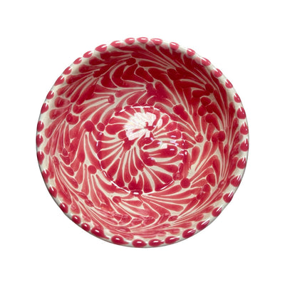 Top view of a ceramic bowl with a white and pink Puebla design