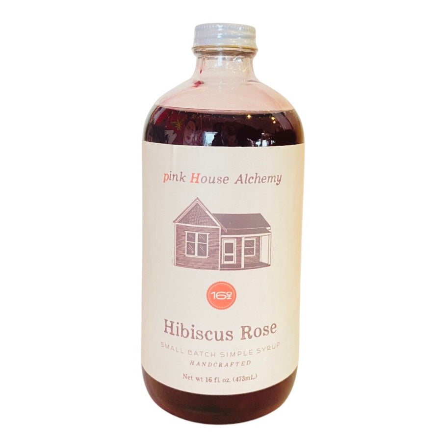 Front view of Hibiscus Rose Simple Syrup in clear glass branded bottle with white lid