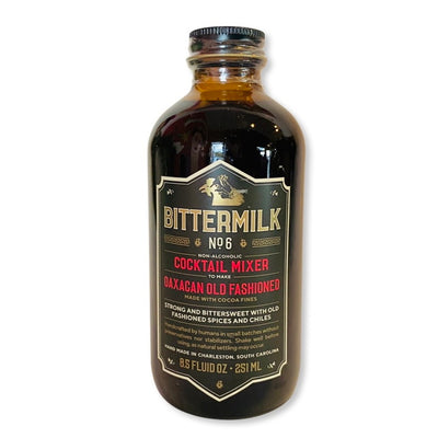 A 8.5 fluid ounce jar of Bittermilk No. 6 bitter with black, red and gold branded labeling.