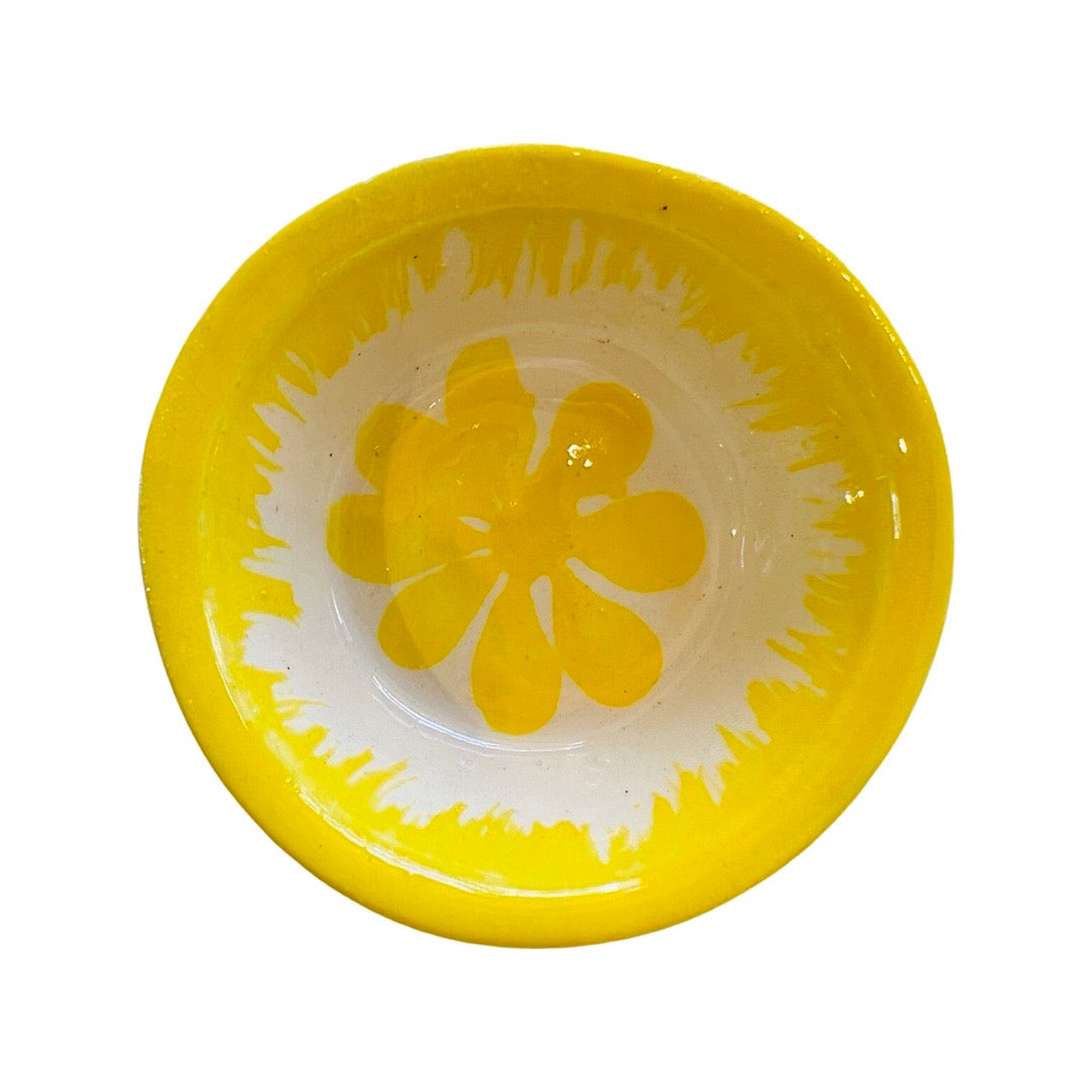 top view of yellow bowl with handpainted yellow flower