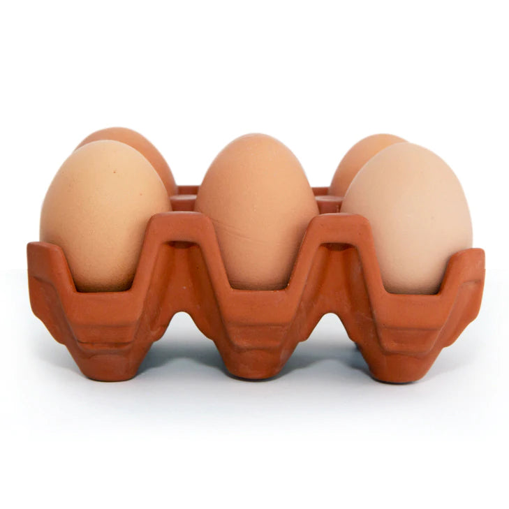 front view of terracotta 6 egg holder with brown eggs in holder.