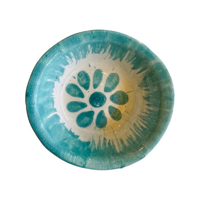 top view of turquoise bowl with handpainted turquoise flower