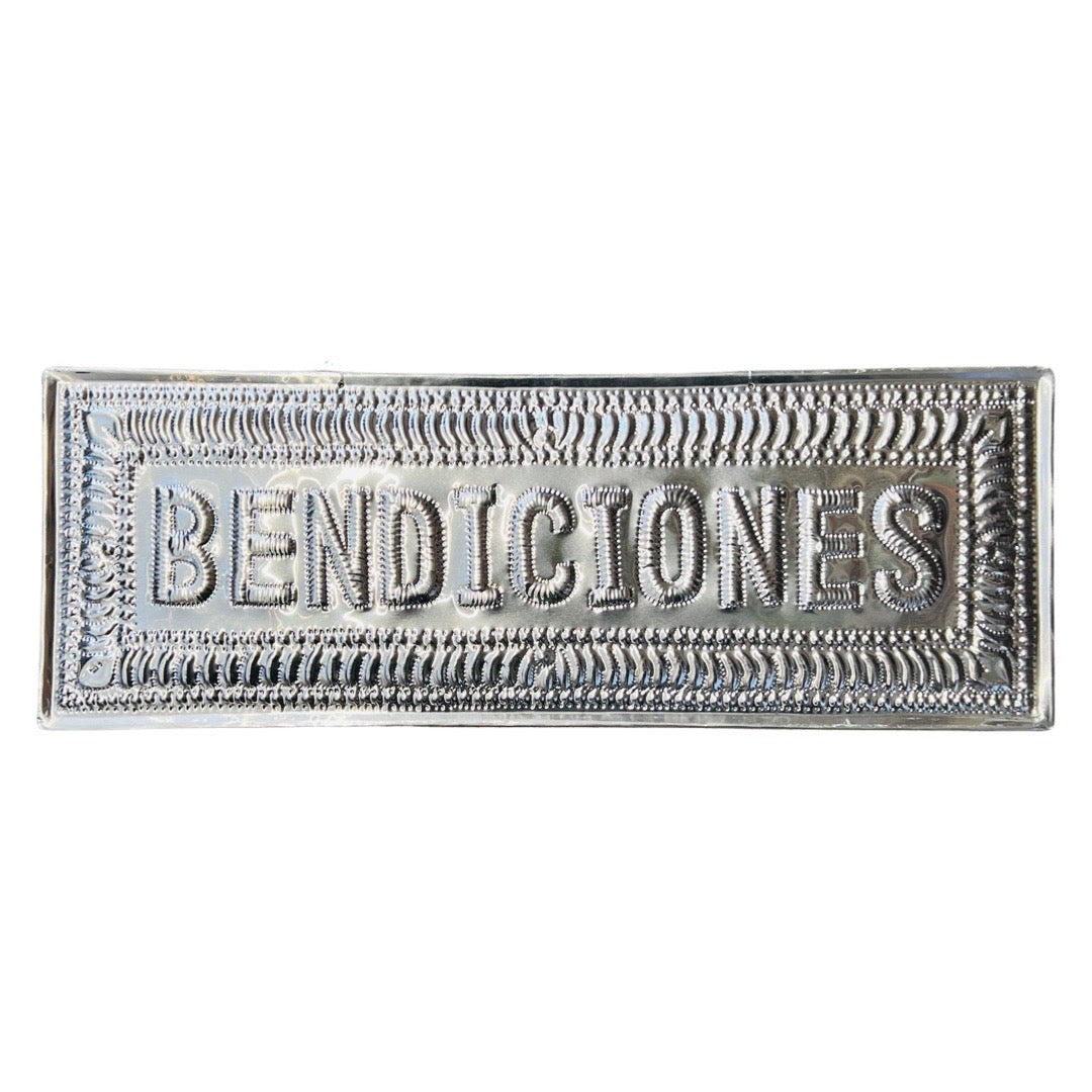 A silver hammered aluminum sign with the word 'Bendiciones' 