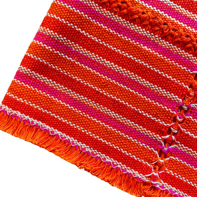 quarter folded napkin with horizontal orange and red stripes