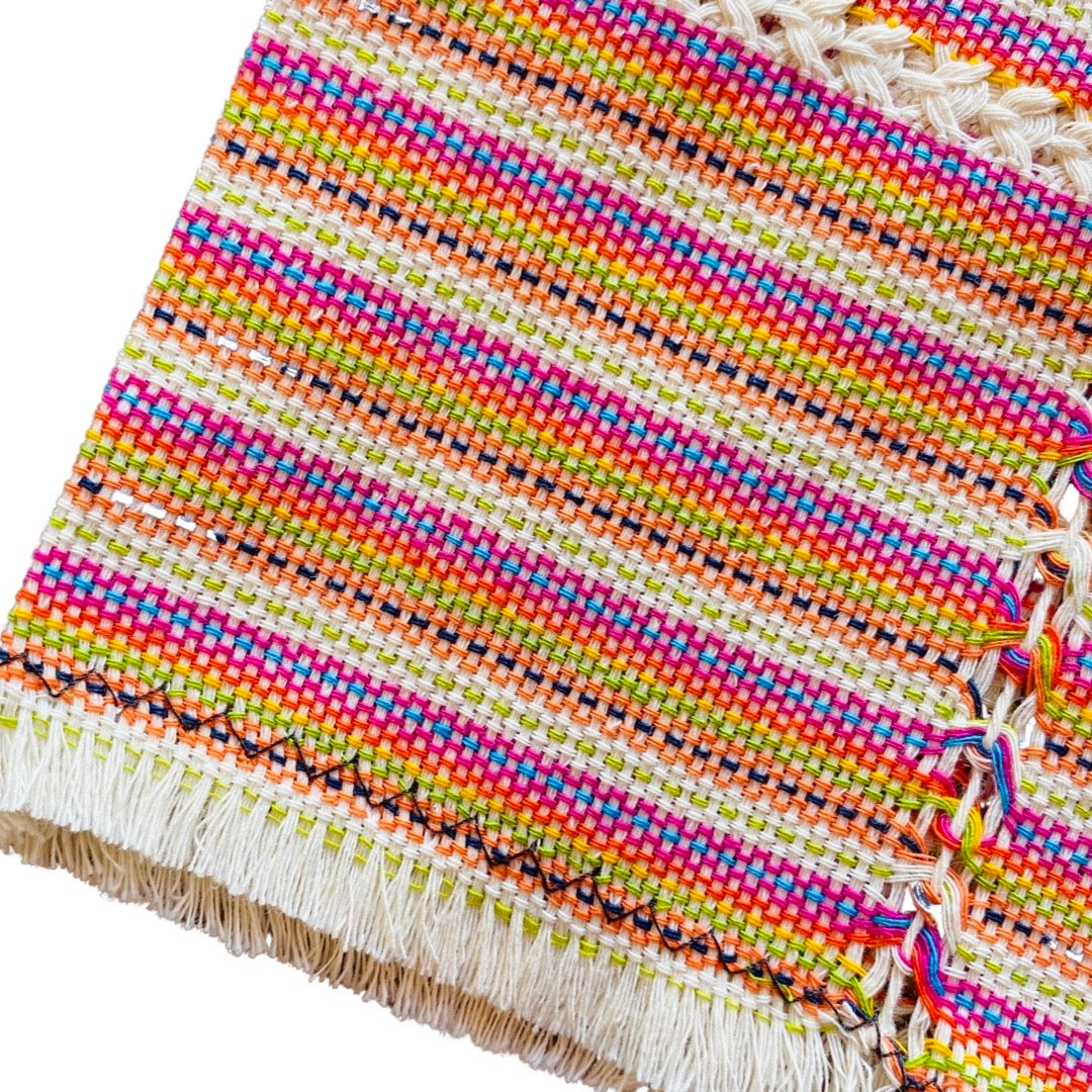 quarter folded napkin with vertical rainbow stripes