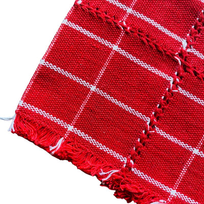quarter folded red napkin with white stripes