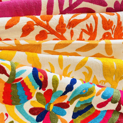 5 otomi table runners in various color combinations: Multicolor, yellow, mustard, orange, & pink