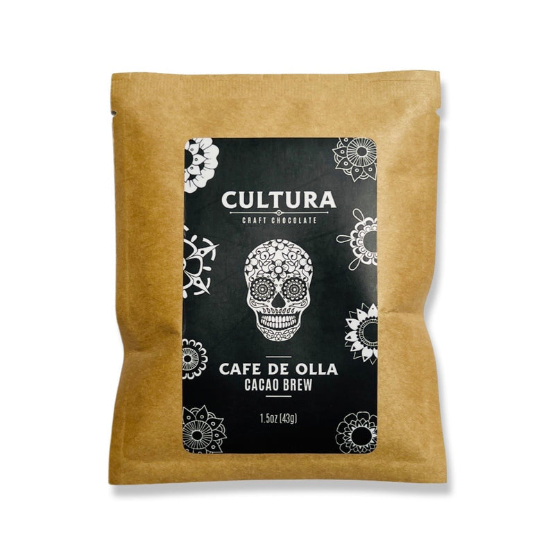 Single 1.5 ounce craft packet of cafe de olla (coffee from a pot) cacao brew. Label is black and white with a sugar skull in the center and various flowers designs around the border.