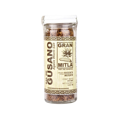 front view of Sal De Gusano (Agave Worm Salt, 100% Chinicuil) in clear glass jar with white lid