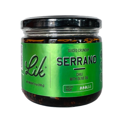 front view of Serrano Chili with Olive Oil in clear glass branded jar
