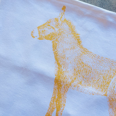 enhanced view of printed detail on Gold Burro Kitchen Towel